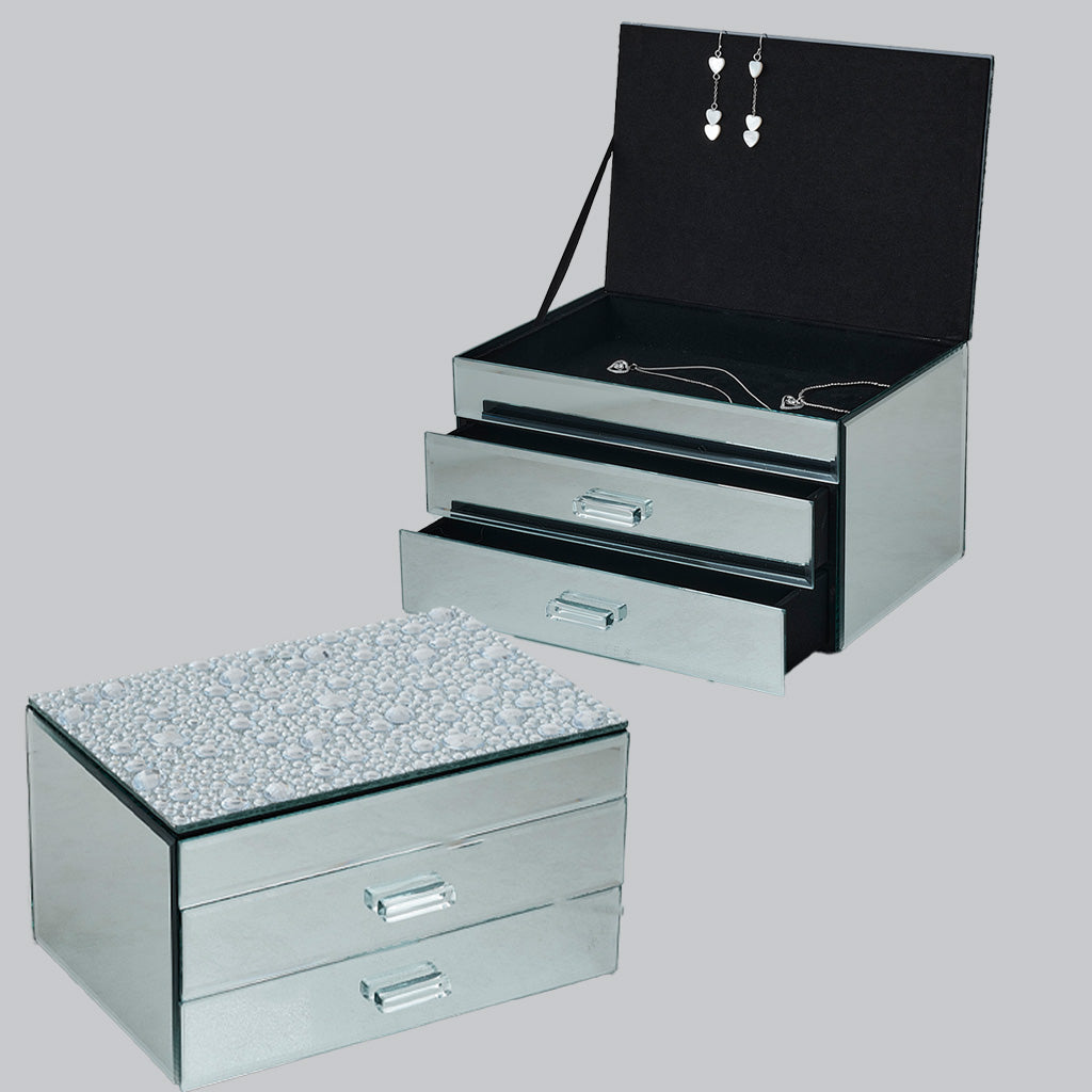 A mirrored jewelry box set shown on a light gray background, including a closed three-drawer storage box with a sparkling clear top and an open matching box with a black interior and jewelry displayed inside.