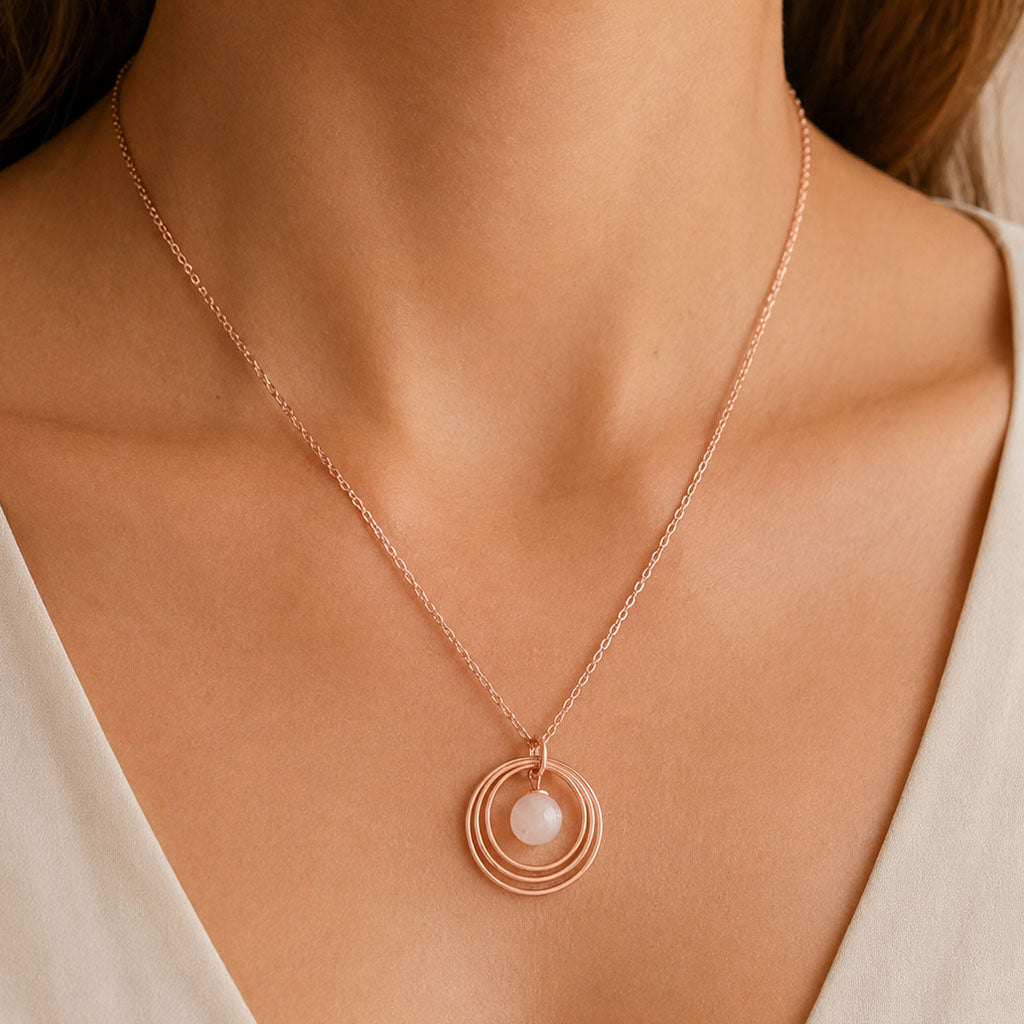 Rose Gold Plated & Rose Quartz Triple Disc Necklace on model wearing it around their necklace line