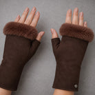 model wearing A pair of dark brown suede gloves with thick brown fur cuffs,